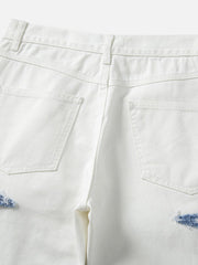 Jean droit déchiré à blocs de couleurs