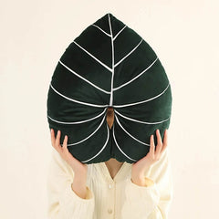 Coussin en peluche à feuilles tropicales