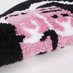 Herzförmiger Akzentteppich mit Kuhmuster