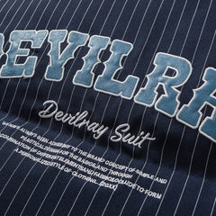 Pufferjacke mit gestickten Buchstaben und Streifen