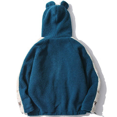 Manteau d'hiver en sherpa patchwork avec ours brodé