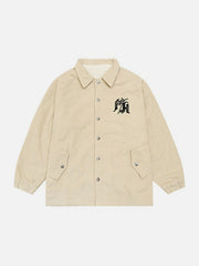 Wintermantel aus Cord mit gotischer Monogramm-Stickerei