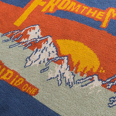 Pull en tricot contrasté à motif montagneux