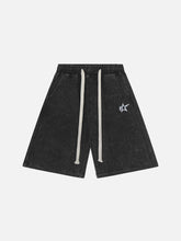 Short délavé à rayures latérales