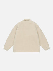 Einfarbiger Sherpa-Wintermantel mit mehreren Taschen und Etikett