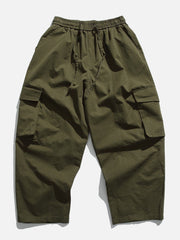 Pantalon cargo à poches de couleur unie