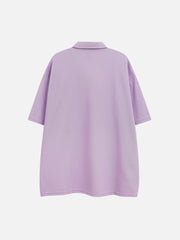 T-shirt à col polo et bretelles brodées 