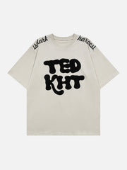 T-Shirt mit beflocktem, besticktem Buchstaben 