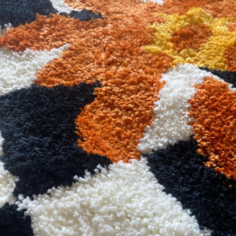 Checkered Orange Flower Accent Rug